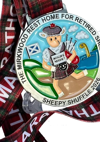 Fully enamel bespoke medal with a tartan ribbon and a bagpiping sheep design, Sheepy Shuffle 2026