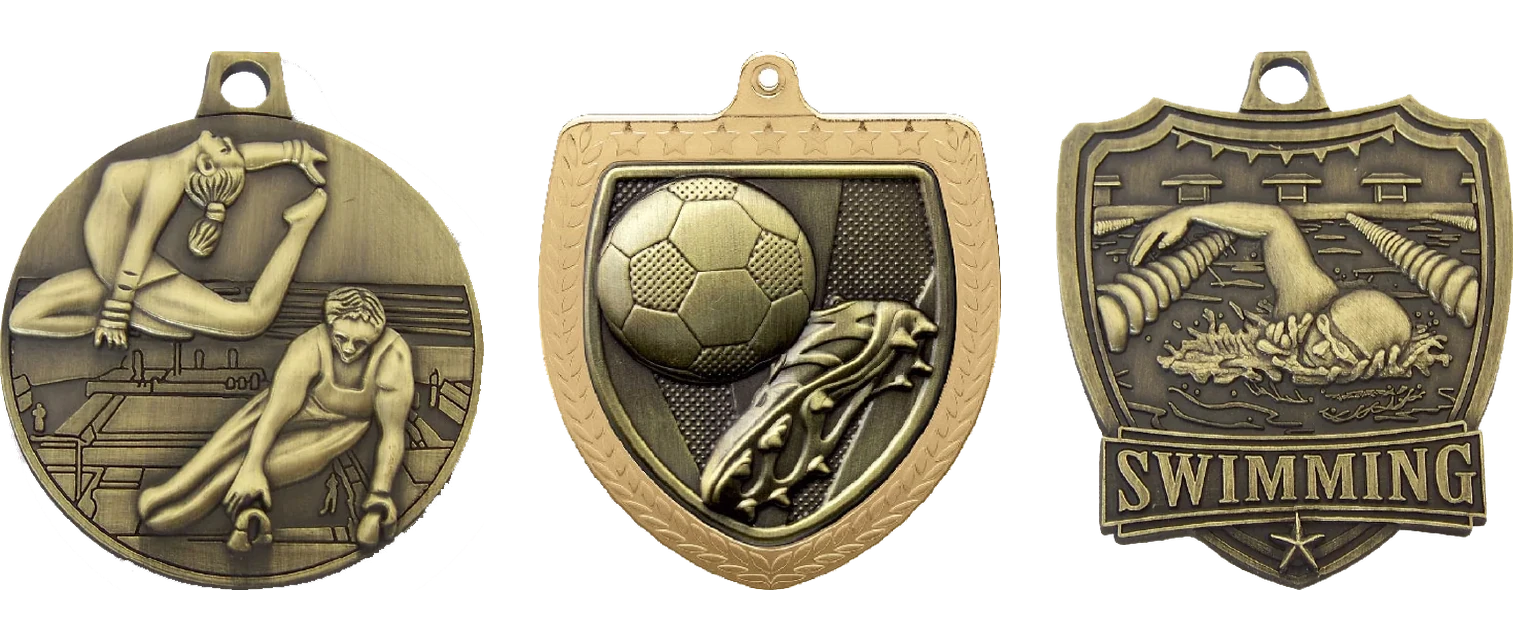Gymnastics, football and swimming engravable medals