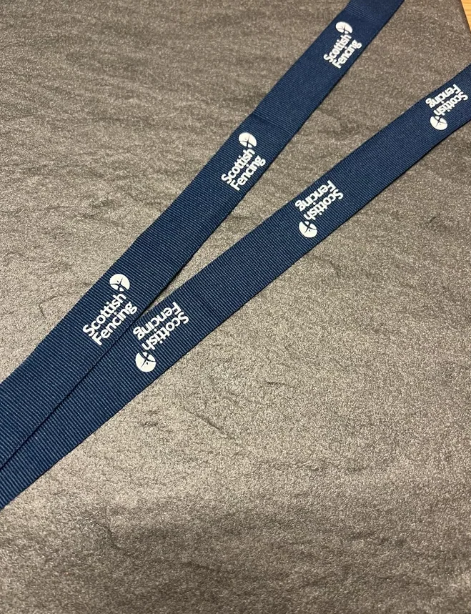 Scottish Fencing printed on a navy woven ribbon