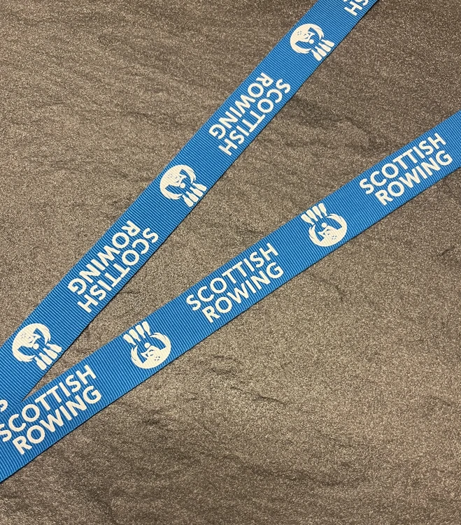 Scottish Rowing logo printed in white on a blue woven ribbon