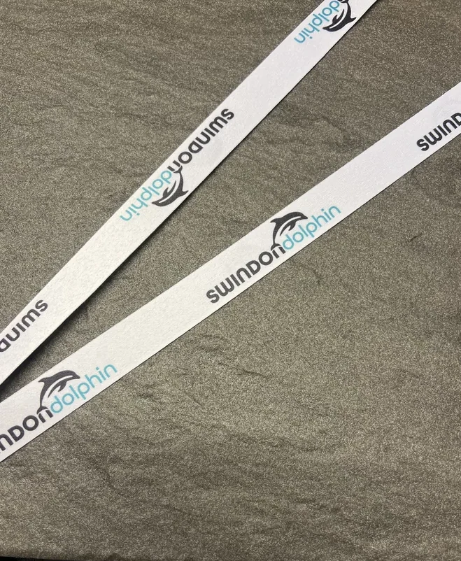 Swim on Dolphin on a white sublimation ribbon